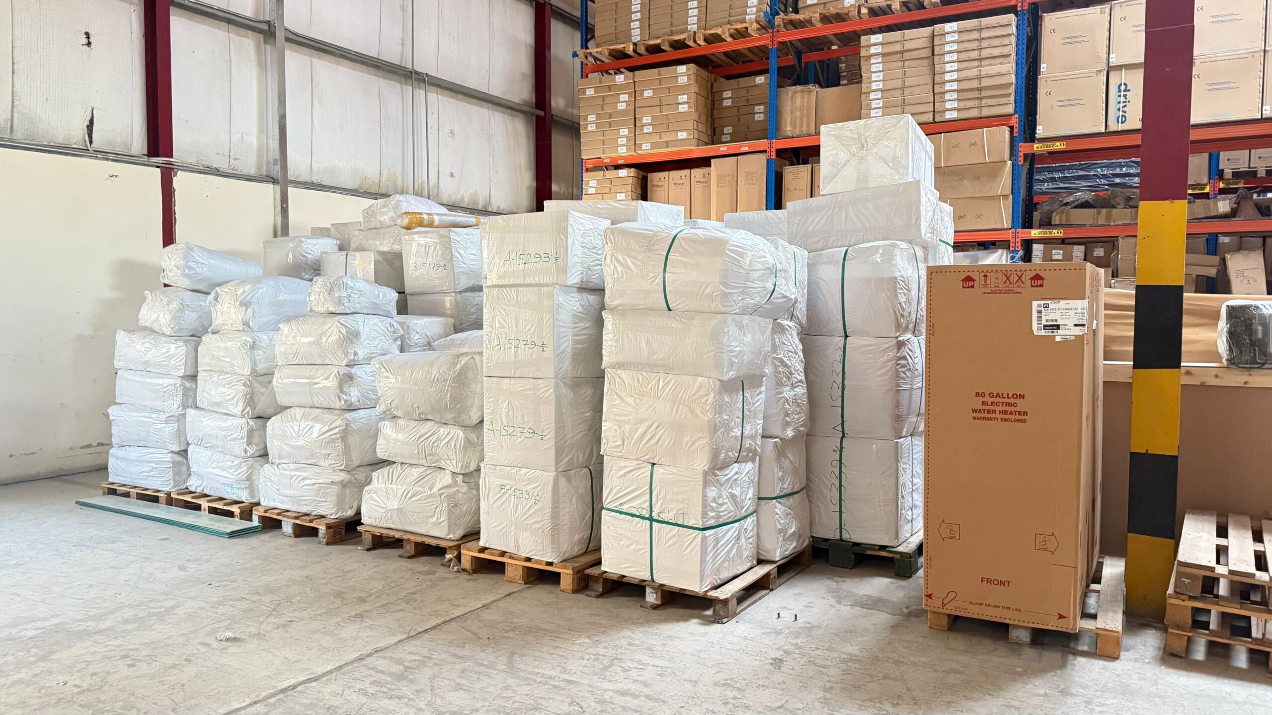 "Packed cargo pallets and wooden crates prepared for shipment inside a warehouse, showcasing organized cargo logistics in Qatar and professional freight handling."